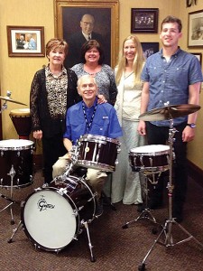 Fourth- and fifth-generation Gretsch family members pose at the Gretsch studio.